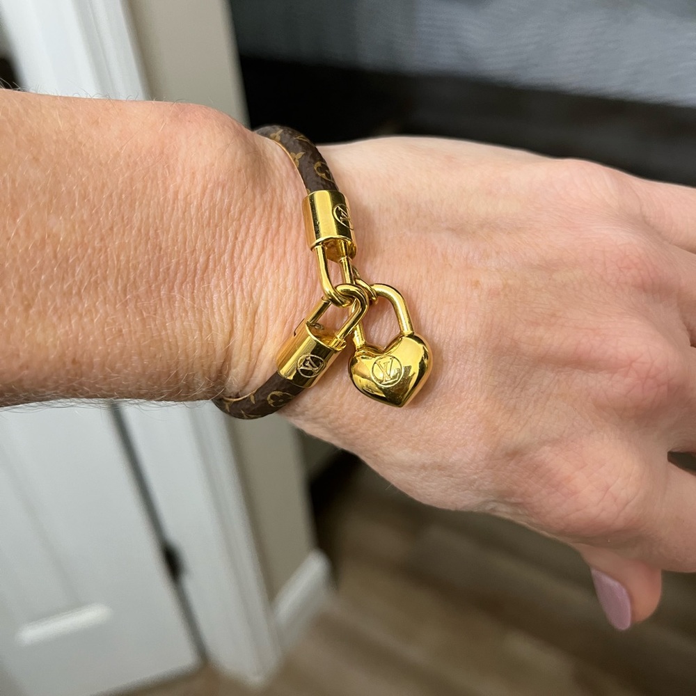 Louis Vuitton bracelet with gold heart charm. Size small